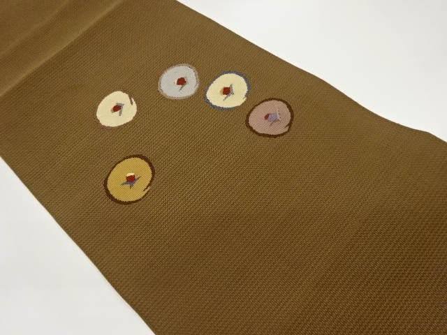 丸に抽象花葉模様織出し名古屋帯